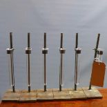 A set of six Industrial test tube holders