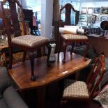 An Art Deco walnut dining table, raised on two pillar supports, H.75 W.154 D.78cm