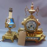 A late 19th century French gilt metal mantle clock, the porcelain dial with Roman numerals, urn