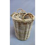Three wicker baskets of graduating size, H.59cm (tallest) (3)