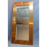 A Contemporary copper clad mirror, with bevelled plate, 180 x 90cm