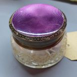 A cut glass cosmetic jar with silver and cloisonne enamel lid, hallmarked Birmingham, H.6cm Diameter