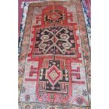 A fine North West Persian Hamadan rug, having central geometric motifs on a rouge field within a