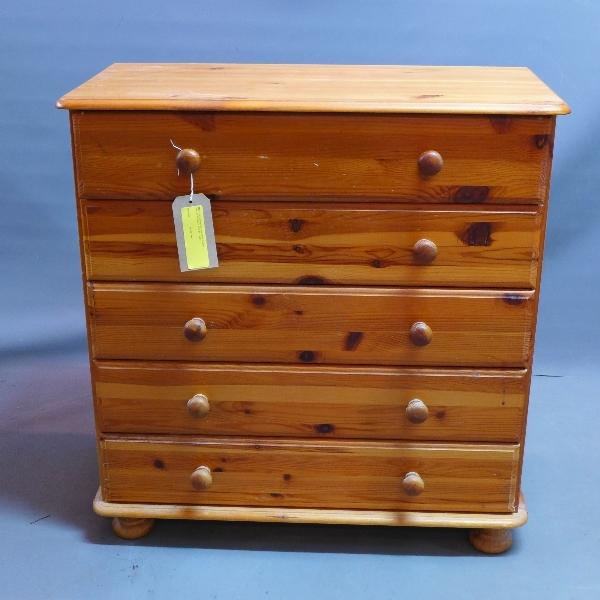 A 20th century pine chest of five drawers, raised on bun feet, H.83 W.80 D.39cm