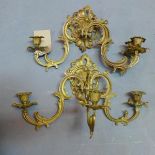 A pair of Rococo style gilt metal three branch wall sconces