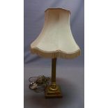 A late 20th century brass table lamp, with reeded column raised on square base