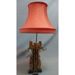 A mid 20th century Chinese gilt wood and ebonised table lamp