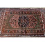 A fine Northwest Persian Zanjan rug with central diamond medallion on a terracotta field contained