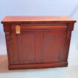 A 19th century rosewood side cabinet, single drawer over two cupboard doors, raised on stepped base,
