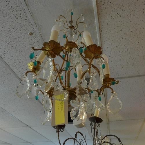 A mid 20th century French gilt metal six branch chandelier, have clear glass drops and turquoise