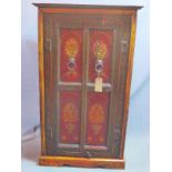 A late 20th century Indian teak hall cupboard, with floral decoration, H.147 W.86 D.53cm