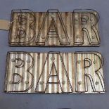 A pair of industrial 'BAR' signs with back lights