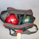 Two vintage bowling balls in carry case