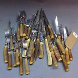 A collection of Walker & Hall cutlery having antler handles, comprising knives, forks, sharpening