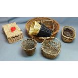 A collection of wicker items to include a picnic basket, dog basket, handled baskets and waste paper