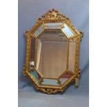 A late 20th century gilt wood panelled mirror, with carved border, central bevelled plate, 158 x