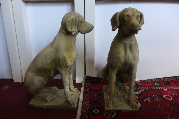 A pair of reconstituted stone hunting dogs, seated on rectangular bases, H.75cm, (2)