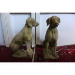 A pair of reconstituted stone hunting dogs, seated on rectangular bases, H.75cm, (2)