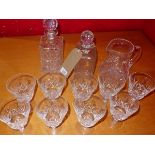 Nine Stuart crystal glasses, together with two glass decanters and a glass jug, (12)