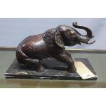 A Contemporary bronze study of an elephant, raised on marble base
