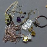 A collection of jewellery, to include a white metal mounted amethyst pendant, a silver and three
