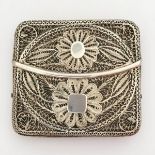 A Persian white metal filigree cigarette box, with floral decoration, W.8cm, together with a white