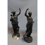 Two cast bronze figural studies of Classical ladies, one with a sheath of arrows and hound, the