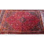 A Quashqai carpet, with central geometrical diamond medallion, contained by geometric motifs and