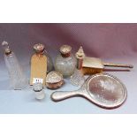 A collection of early 20th century vanity items, to include cut glass and silver topped scent