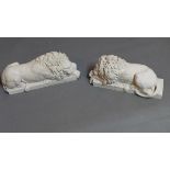 A pair of reconstituted marble studies of recumbent lions, the bases with plaques styled as