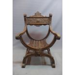 A mid 19th century oak Savonarola chair