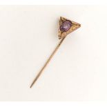 A yellow metal brooch, modelled as a sheath of arrows, decorated with flowers inset with diamonds,