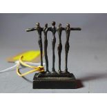 After Alberto Giacometti, a bronzed resin figural study, 'All for One', H.6cm