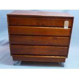 A late 19th / early 20th century walnut and mahogany chest, with four drawers, raised on later