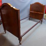 An early 20th century burr walnut single bed