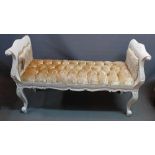 A Louis XV style white painted window stool, with velvet button down upholstery, raised on