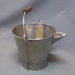 A mid 20th century stainless steel bucket, with spout