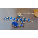 A blue agate and white metal jewellery suite, comprising of a pendant, ring, earrings and bracelet