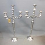A pair of chrome two branch candelabras, H.100cm