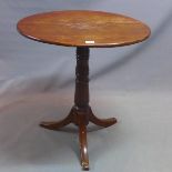 A late 19th century oak tilt top occasional table