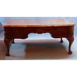 A mid 20th century burr walnut bureau plat, with nine drawers, raised on cabriole legs, ball and