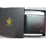 A Buckingham Palace black leather wallet, in original box