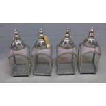 A set of four silvered storm lanterns, H.50cm