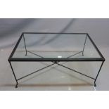 A wrought iron coffee table, with glass top, H.51 W.110 D.70cm