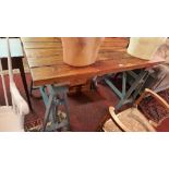 A Contemporary kitchen table, with pine top raised on two grey painted trestle bases, H.84 W.141 D.