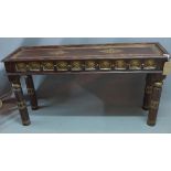 An Indian teak and brass mounted console table, having floral embossed brass panels, H.77 W.150 D.