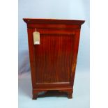 An early 20th century mahogany side cabinet, with single door, raised on bracket feet, H.97 W.57 D.