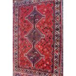 A fine south West Persian Qashqai rug, triple pole medallion with repeating petal motifs on a