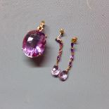 A 9ct yellow gold and amethyst pendant, marked 375, having large oval cut amethyst in pierced 9ct