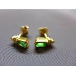 A pair of 18ct yellow gold, emerald and diamond inset earrings, clasp and stem stamped 750